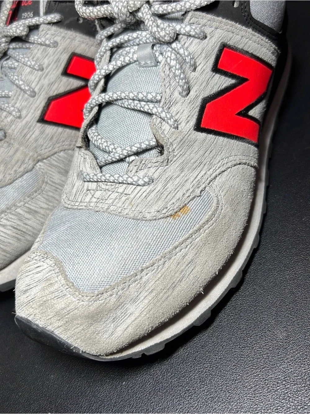 New Balance Men's Light Gray Sneakers with Red Accents